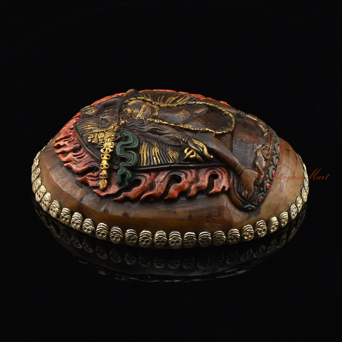 Left side view of the Vajrayogini Carved Resin Kapala with hand-painted skull cup design