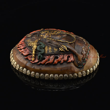 Left side view of the Vajrayogini Carved Resin Kapala with hand-painted skull cup design