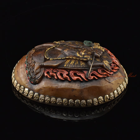 Right side view of the Vajrayogini Carved Resin Kapala showing silver-plated copper detailing