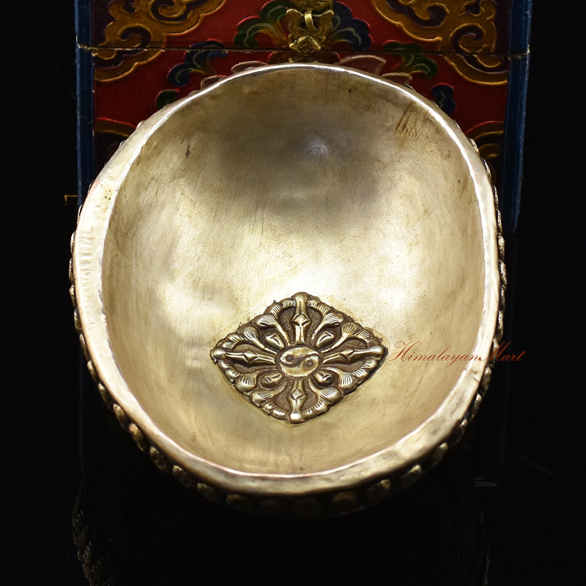 Back view of the Vishvavajra Ashtamangala Resin Kapala showing delicate skull motifs