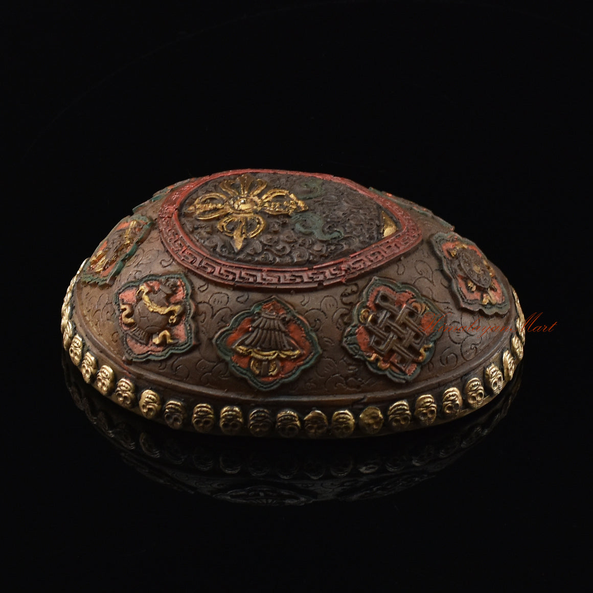 Left side view of the Vishvavajra Ashtamangala Resin Kapala with hand-painted skull cup design