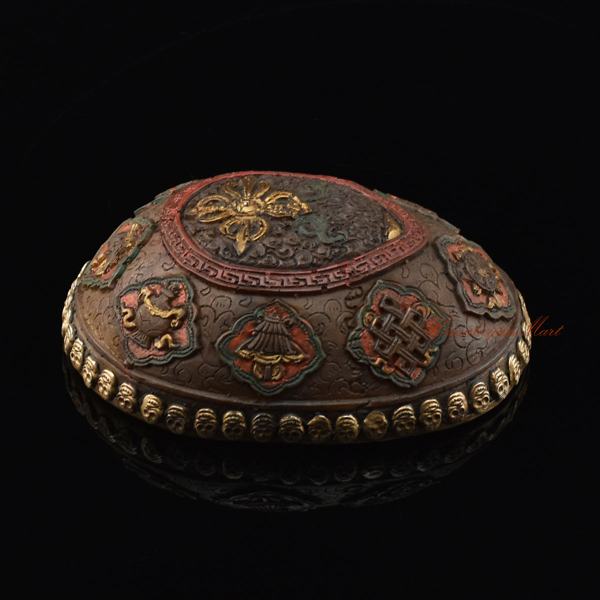 Left side view of the Vishvavajra Ashtamangala Resin Kapala with hand-painted skull cup design