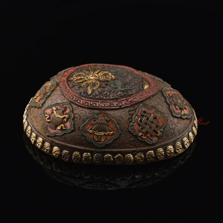 Left side view of the Vishvavajra Ashtamangala Resin Kapala with hand-painted skull cup design