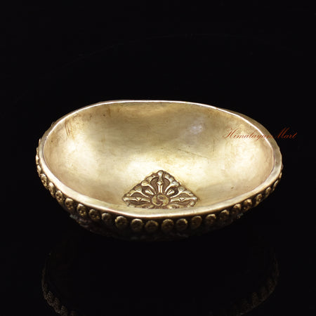 Angled perspective view of the Vishvavajra Ashtamangala Resin Kapala showing full ornate design