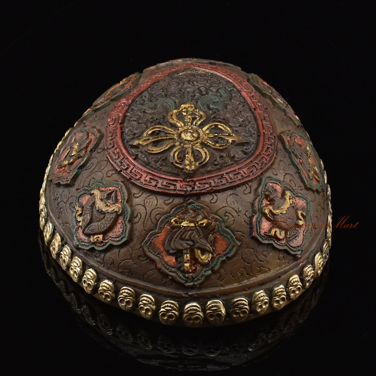 Top view of the Vishvavajra Ashtamangala Resin Kapala highlighting the carved double vajra and eight auspicious symbols