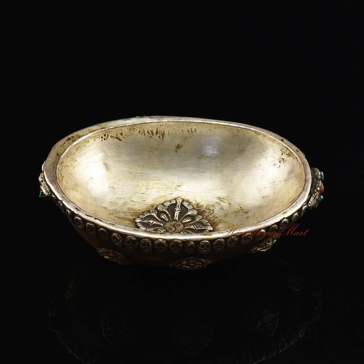 Angled top view of the Viswa Vajra Resin Kapala capturing the full centerpiece and skull-border detailing