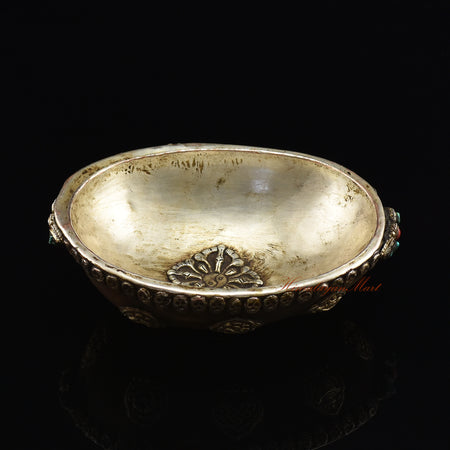 Angled top view of the Viswa Vajra Resin Kapala capturing the full centerpiece and skull-border detailing