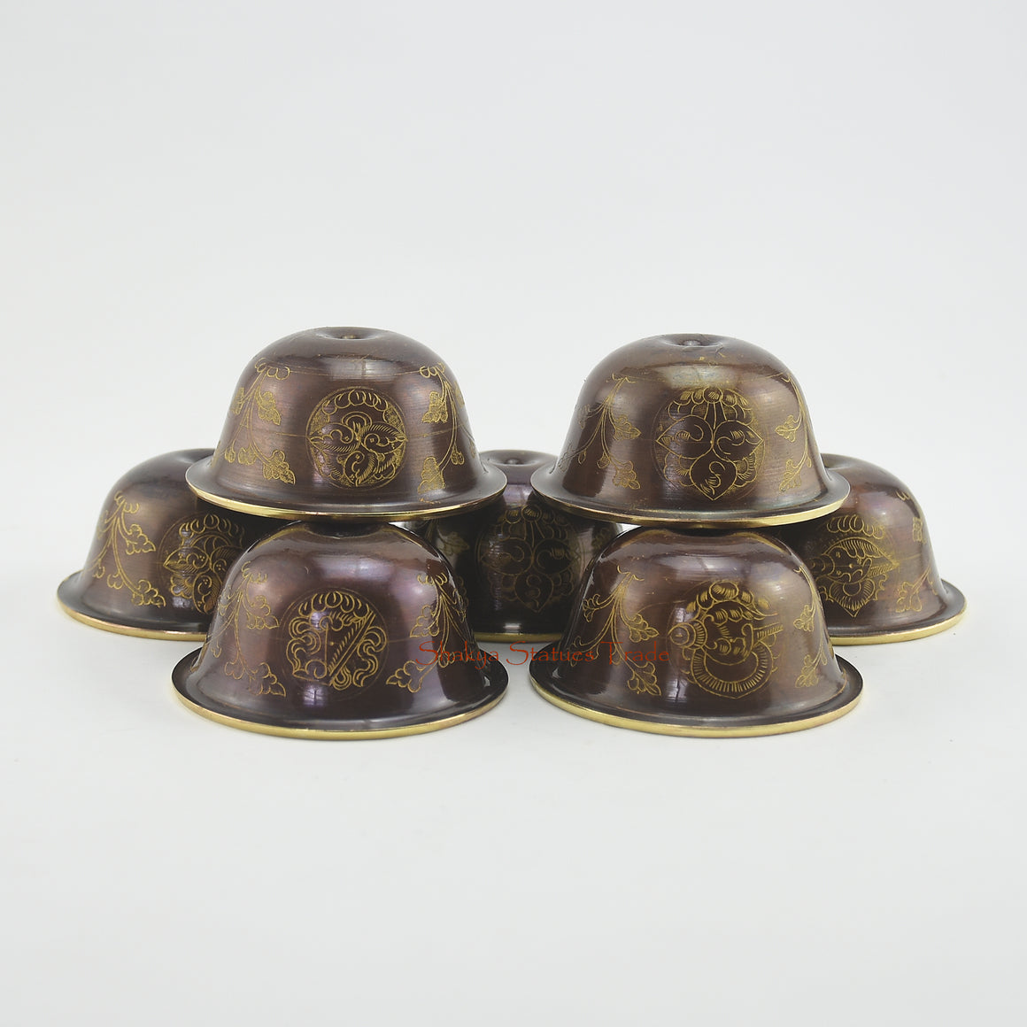 Top view of Water Offering Bowls Set showing seven gilded Tibetan Buddhist ritual bowls