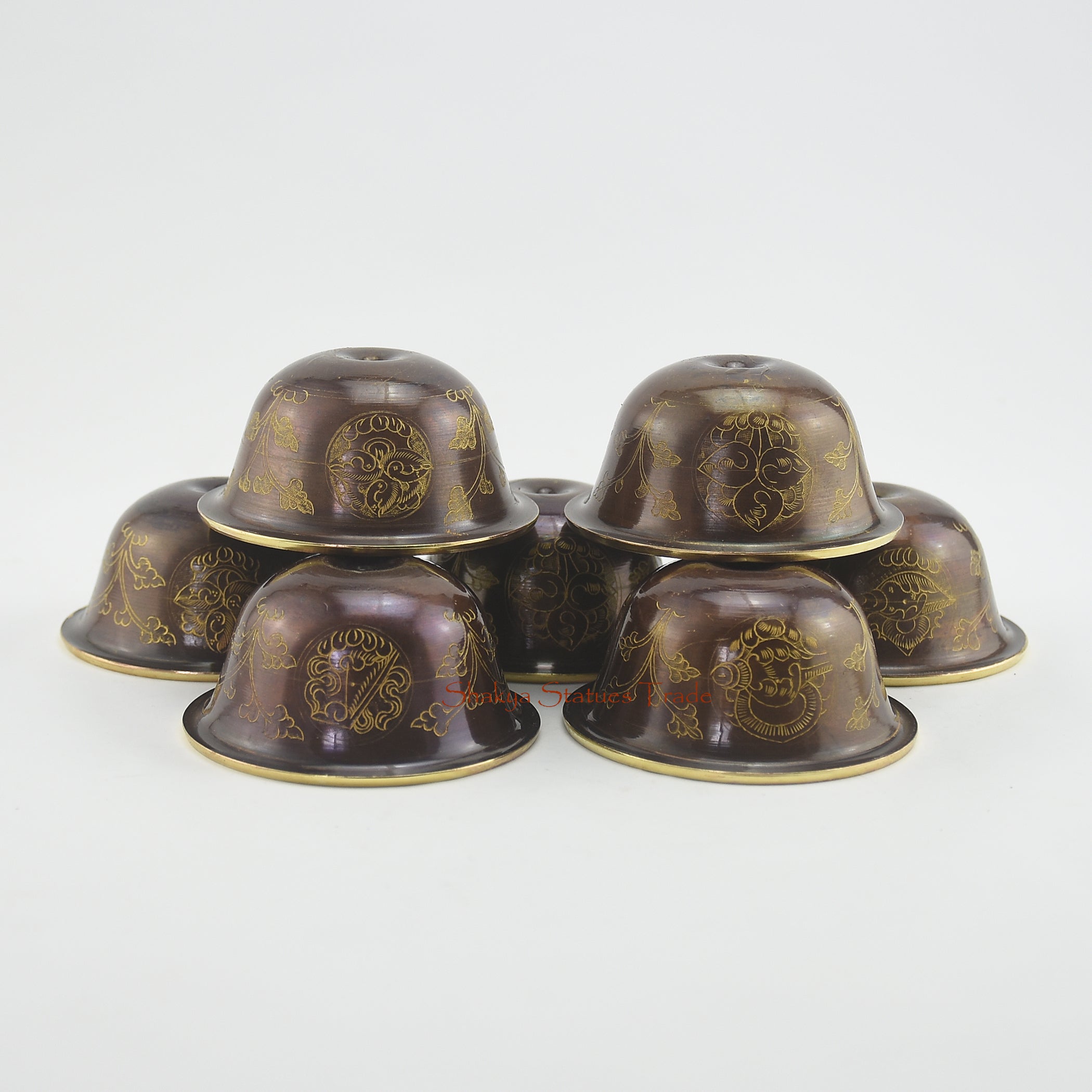 Top view of Water Offering Bowls Set showing seven gilded Tibetan Buddhist ritual bowls