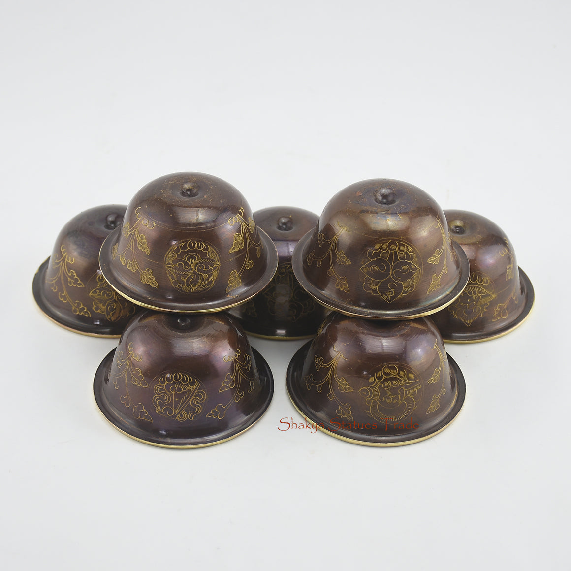 Upper angle of Water Offering Bowls Set highlighting hand-carved copper alloy details with 24k gold gilding