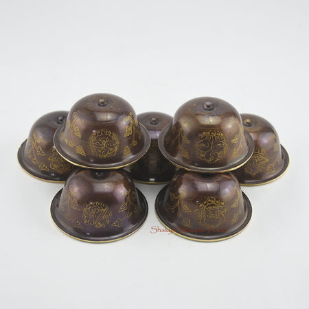 Upper angle of Water Offering Bowls Set highlighting hand-carved copper alloy details with 24k gold gilding