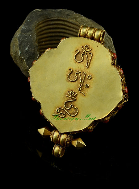 Back view of the White Tara & Chenrezig Ghau Pendant featuring detailed siko filigree carving.