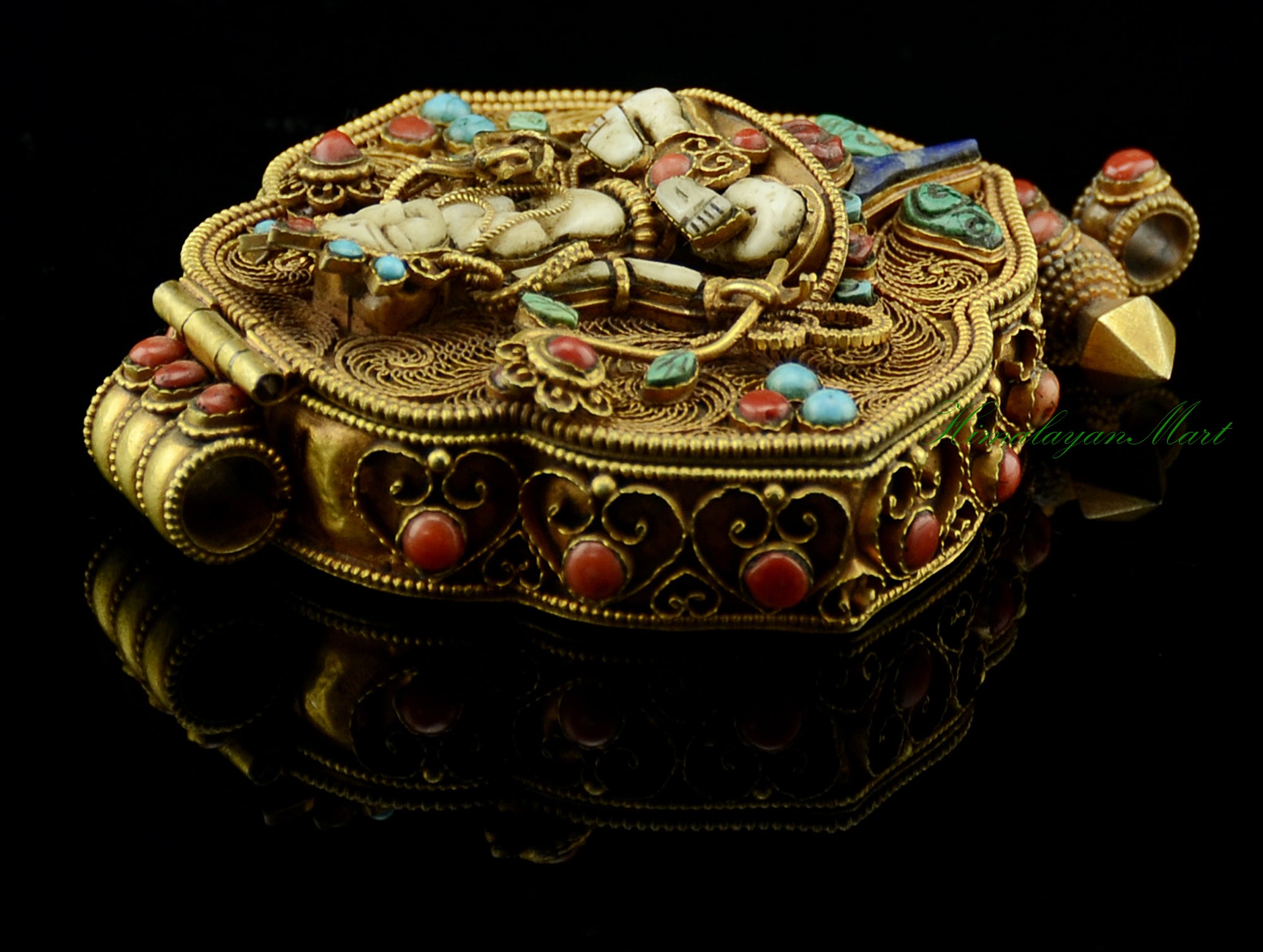 Left-side view of the White Tara & Chenrezig Ghau Pendant highlighting detailed filigree and stones.