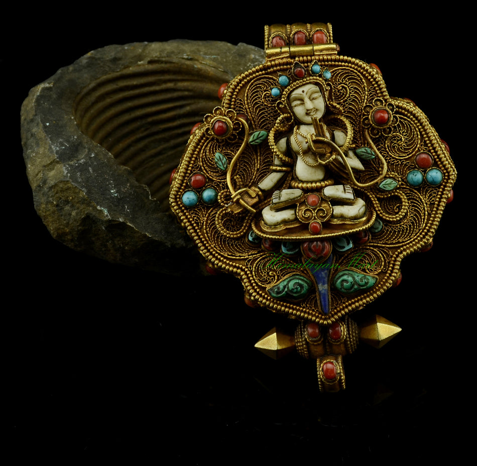 White Tara & Chenrezig Tibetan Ghau Pendant with gold-plated filigree and gemstone inlay.
