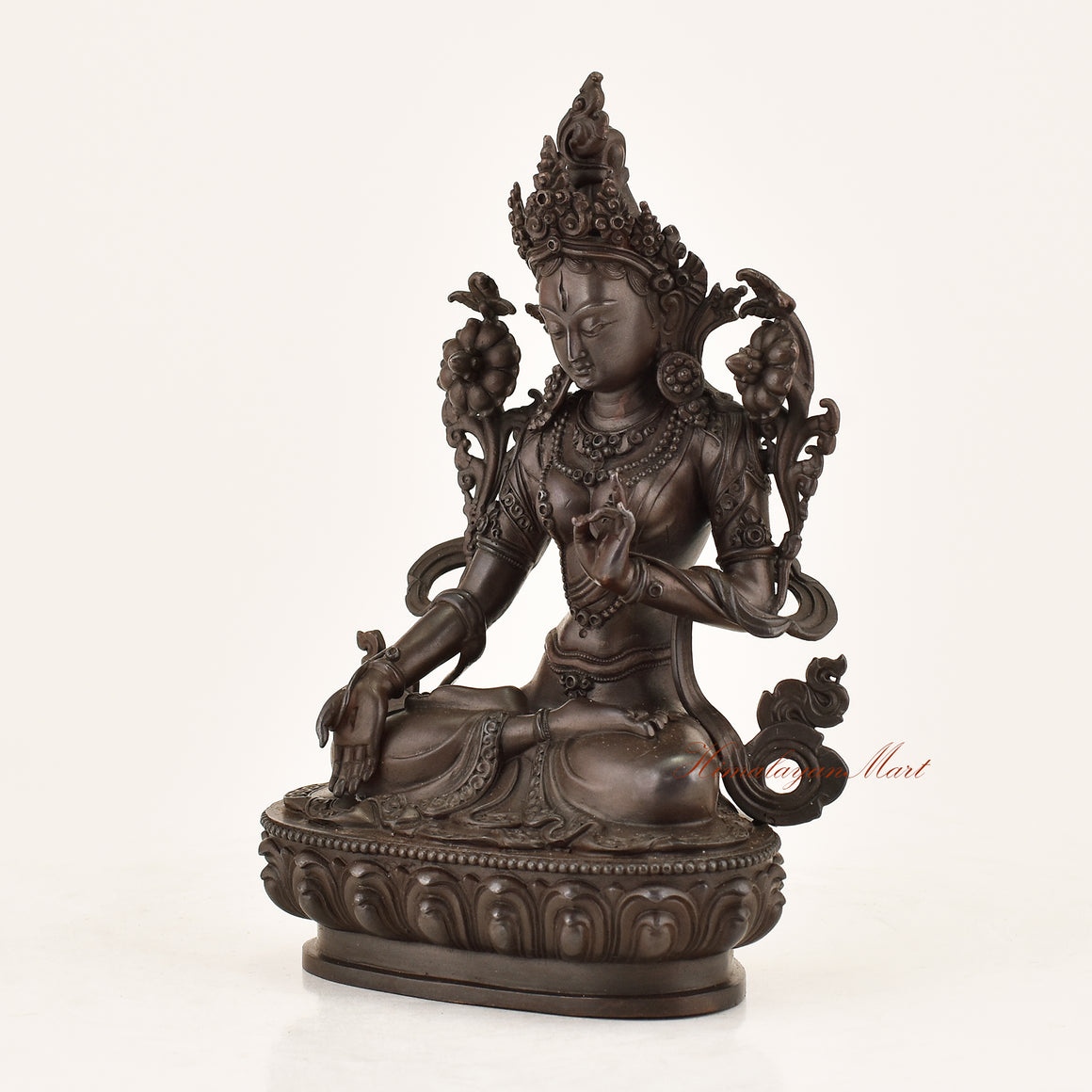 Left side view of the Bodhisattva White Tara Statue revealing intricate copper alloy craftsmanship, utpala lotus detailing, and flowing garment engravings by Nepali master artisans