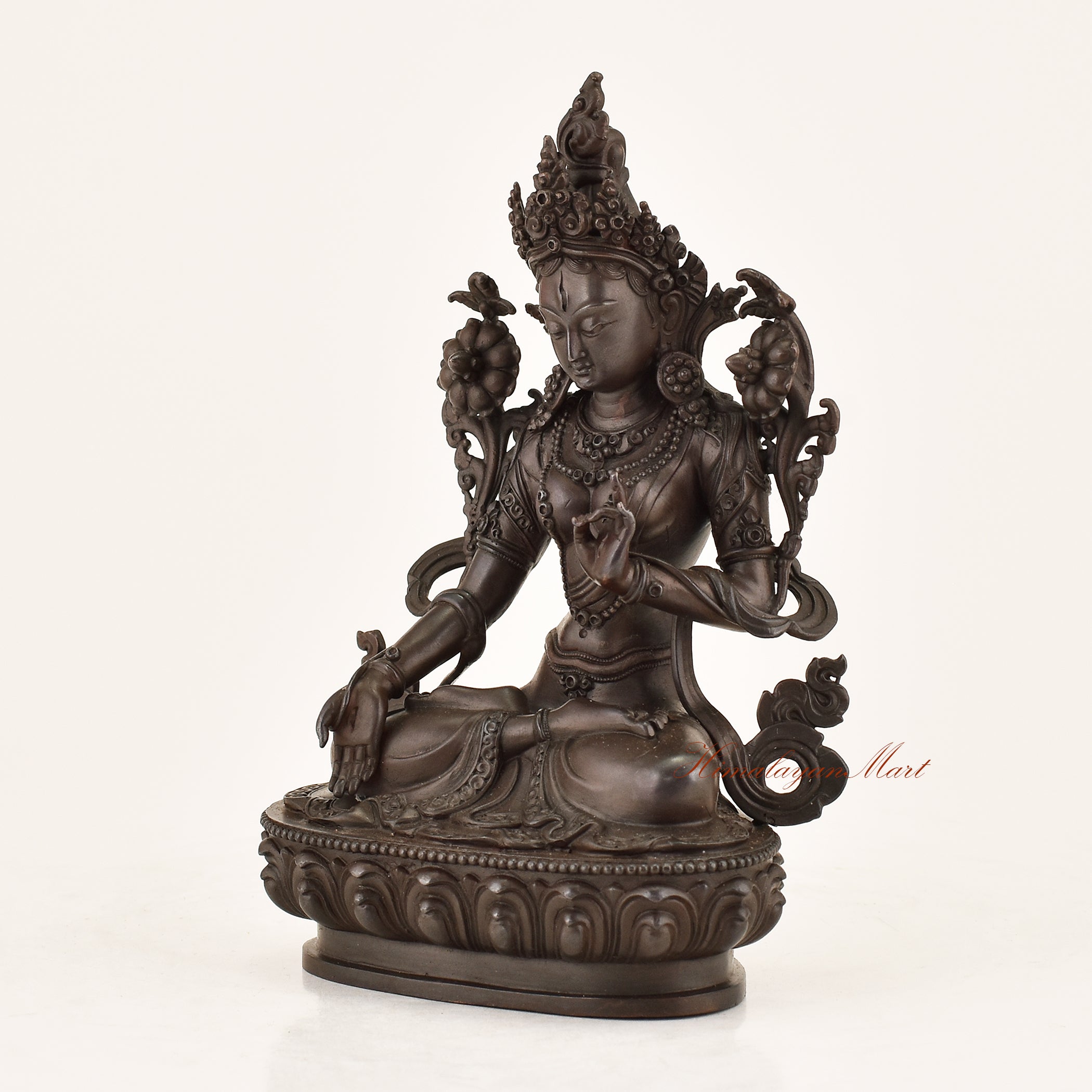 Left side view of the Bodhisattva White Tara Statue revealing intricate copper alloy craftsmanship, utpala lotus detailing, and flowing garment engravings by Nepali master artisans