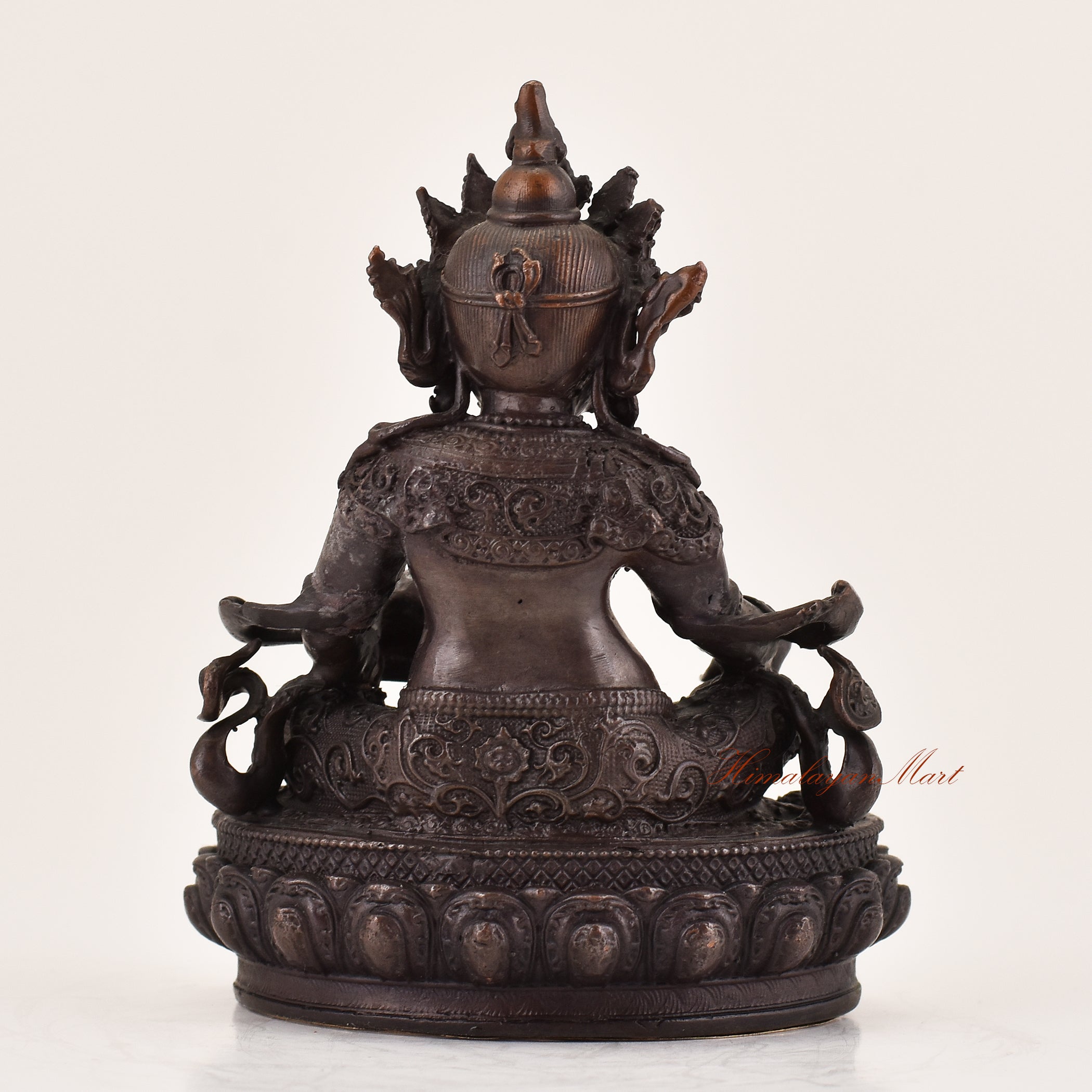 Back view of handcrafted Yellow Dzambhala statue for sale, Tibetan Buddhist wealth deity altar sculpture.