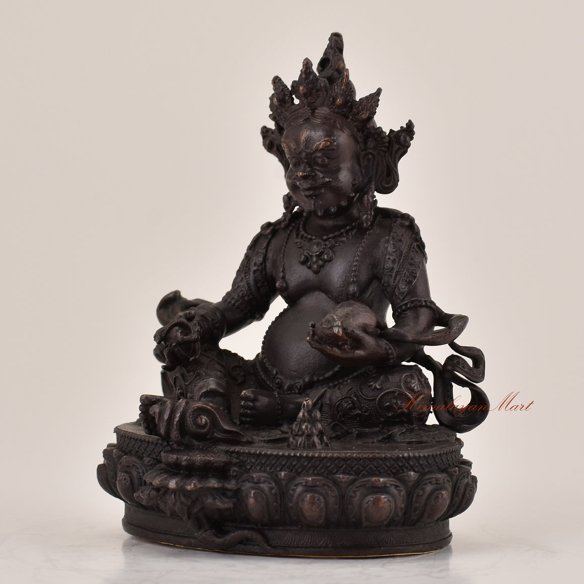 Left-side view of handcrafted Yellow Dzambhala statue for sale, Tibetan Buddhist wealth deity altar sculpture.