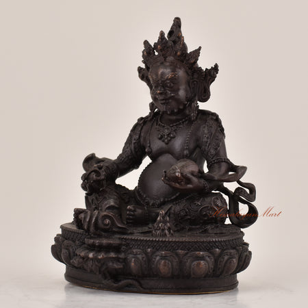 Left-side view of handcrafted Yellow Dzambhala statue for sale, Tibetan Buddhist wealth deity altar sculpture.